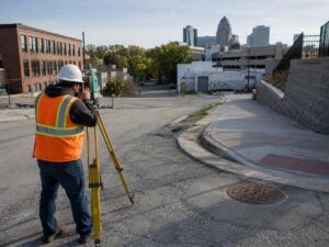 topographic survey urban redevelopment phenix city al - Phenix Land Surveying Topographic Survey crew mapping an urban redevelopment site with pavement and utilities in Phenix City Alabama